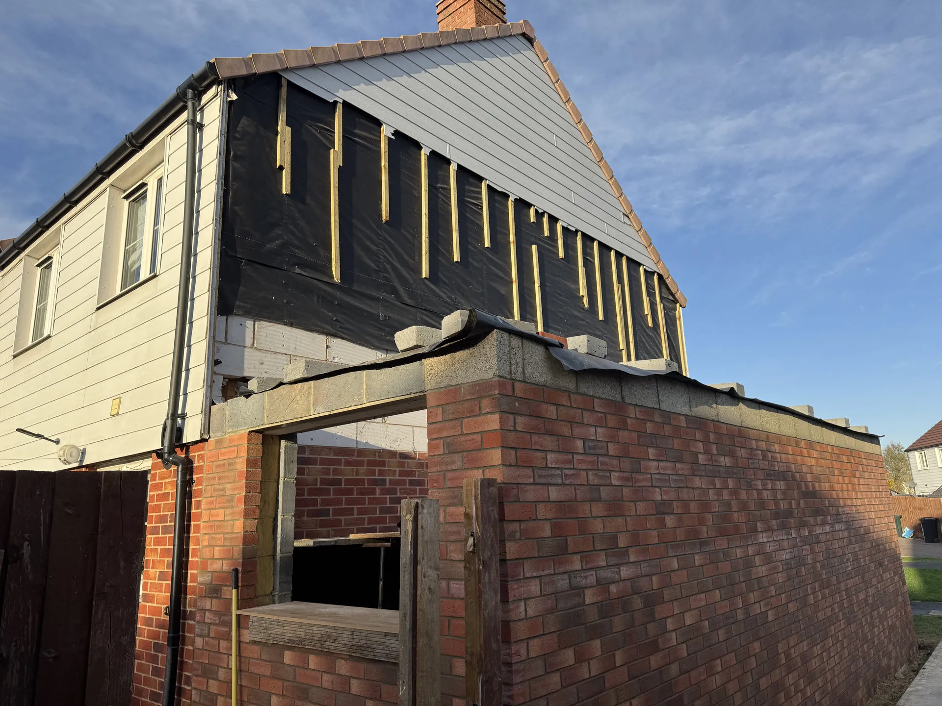 Extension taking shape with cladding and new roof