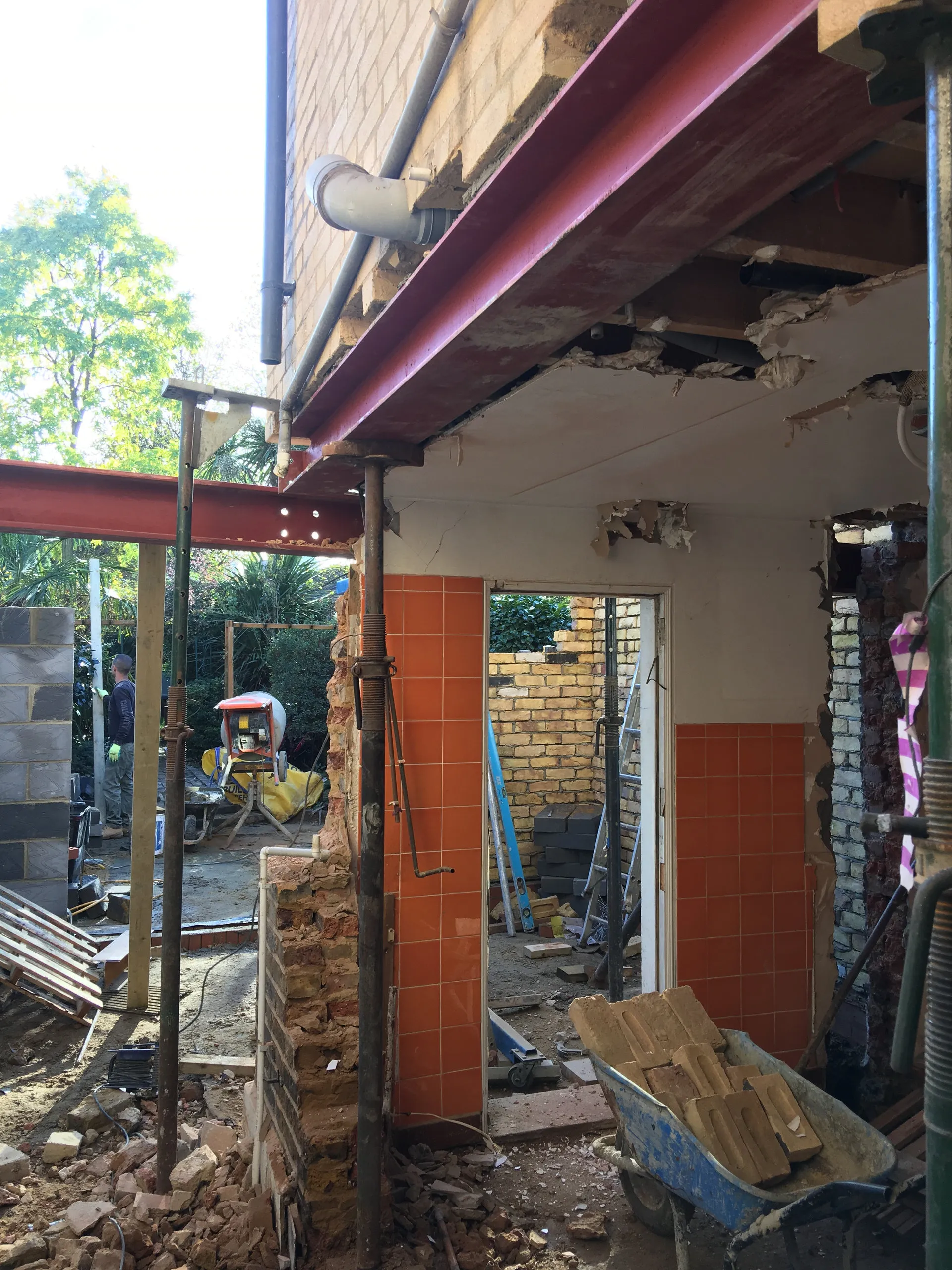 Major demolition with red steel RSJ beams exposed