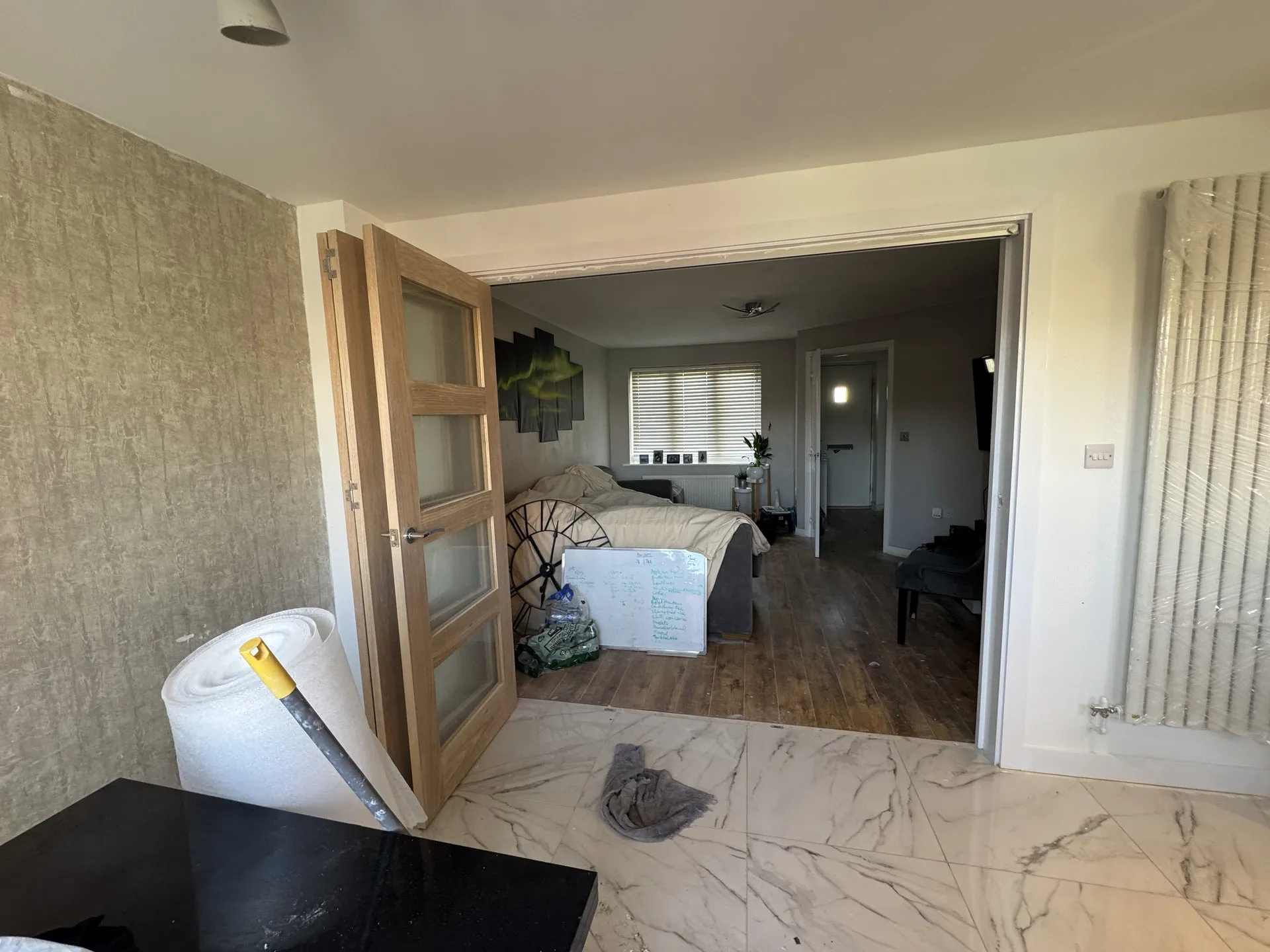Marble tile flooring with radiator during fit-out